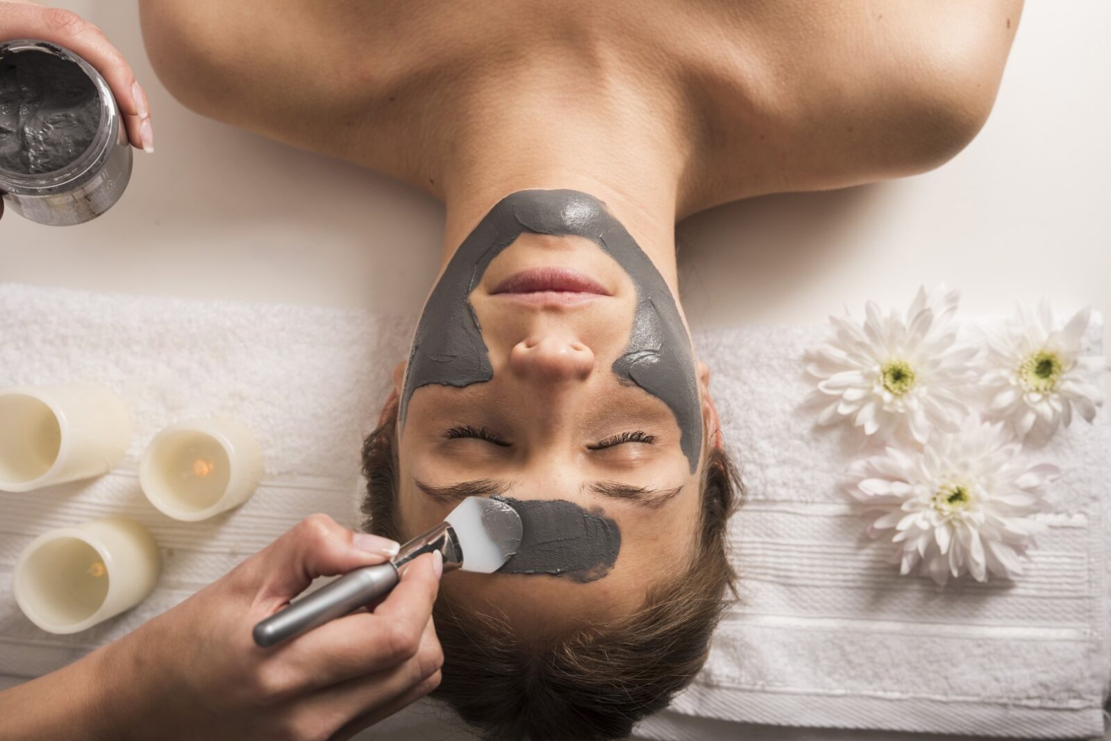 high-angle-view-of-a-woman-receiving-facial-mask-at-beauty-salon